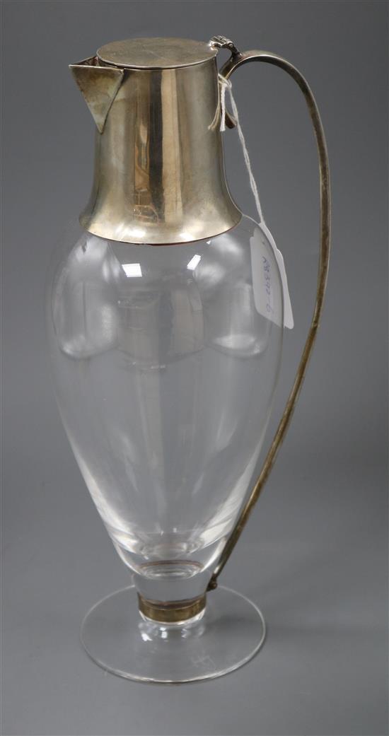 A stylish modern silver mounted glass ovoid claret jug, by Hugh Johnson?, Birmingham, 1995, 30cm.